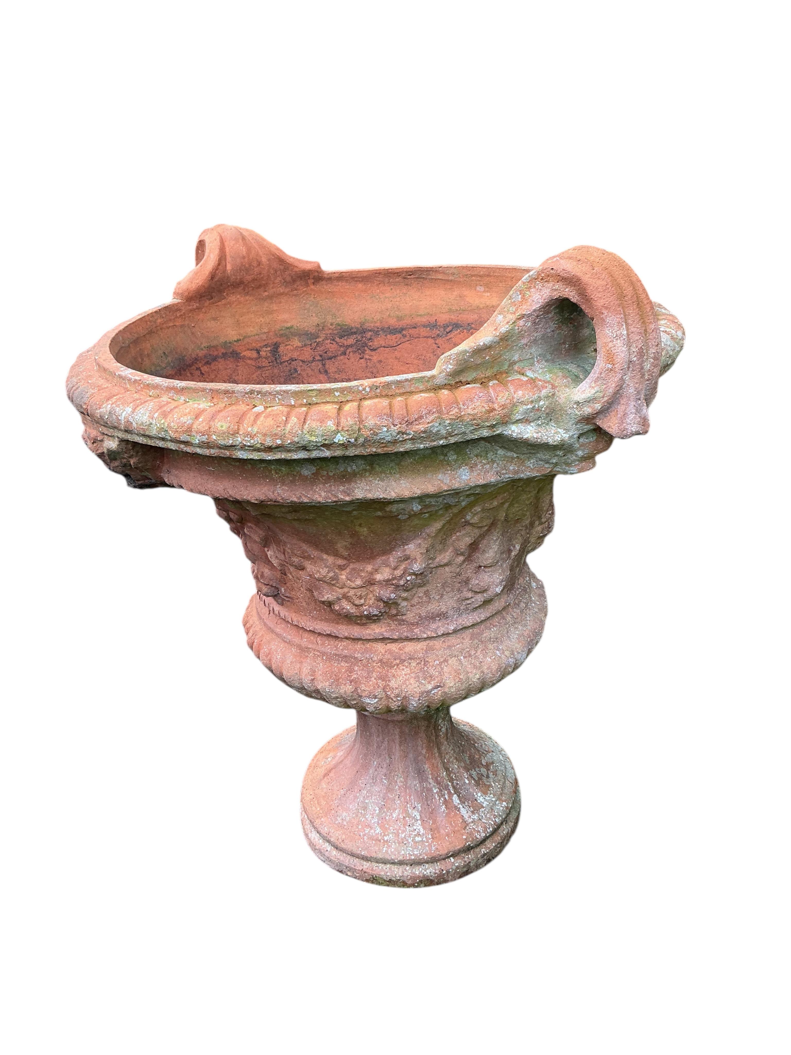 A large circular terracotta planter, diameter 72cm, height 86cm